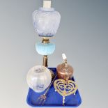 A 19th century oil lamp with blue glass reservoir and shade, porcelain-handled copper kettle,