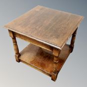 An oak two tier occasional table
