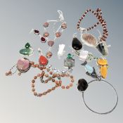 A collection of mostly white metal and silver jewellery, bangles, pendants etc.