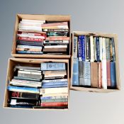 Three boxes containing nautical books.