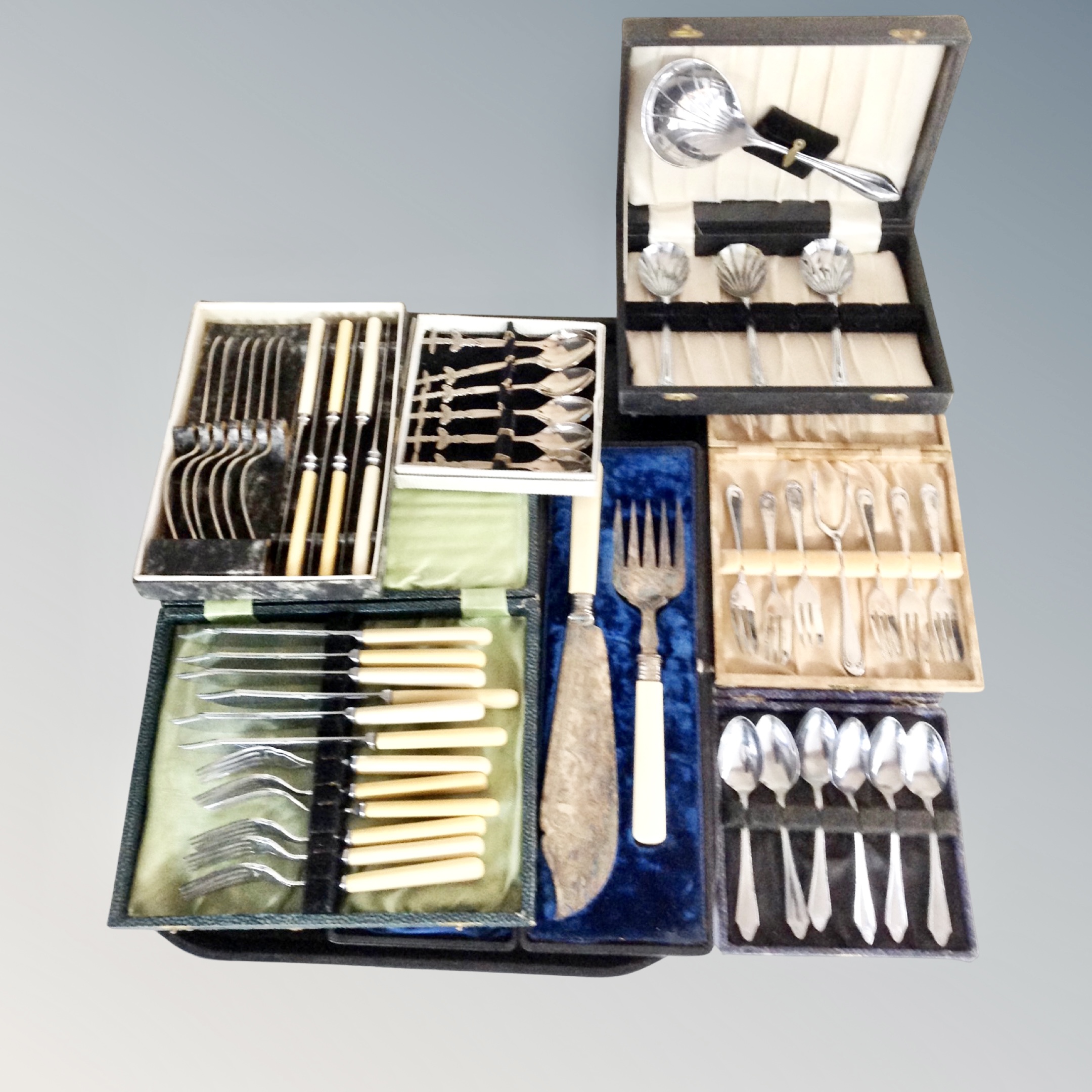 A tray of several cases of epns and stainless steel cutlery,