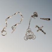 A bag containing assorted silver finish earnings and pendants.