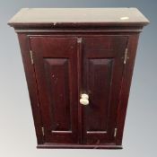 A Victorian mahogany double door wall cabinet fitted with shelves