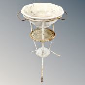 A 19th century wrought iron wash stand with ceramic bowl