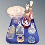 A tray of Mary Gregory-style cranberry glass decanters, comport, chemist's bottle,