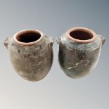 A pair of antique pottery vases. Height 22cm.