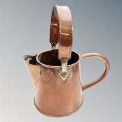 A copper watering can