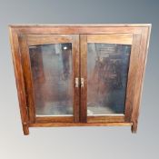 An antique stained oak double glazed door bookcase CONDITION REPORT: no shelves