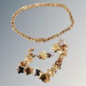 A gilt star bracelet together with a further gilt diamante bracelet.