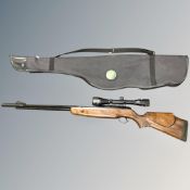 A air rifle with Bushmaster 4 x 40 scope, carry bag and tin of pellets, .