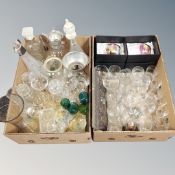 Two boxes containing a quantity of assorted drinking glasses, decanters, jug, biscuit barrels etc.