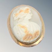 An antique rose-gold cameo brooch, 43 mm x 54 mm.