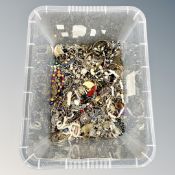 A large plastic box of costume jewellery necklaces etc