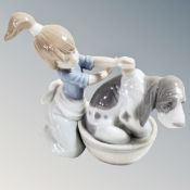 A Lladro figure Bashful Bather, number 5455.