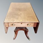 An early Victorian mahogany pedestal table on brass capped feet