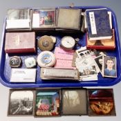 A tray containing assorted collectables to include 19th century glass photographic slides,
