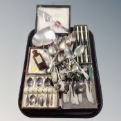 A tray containing assorted cased and uncased silver plated and stainless steel cutlery together