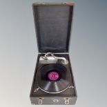 A portable table top vintage gramophone