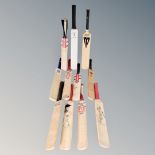 A tray of eleven late 20th and early 21st century miniature cricket bats