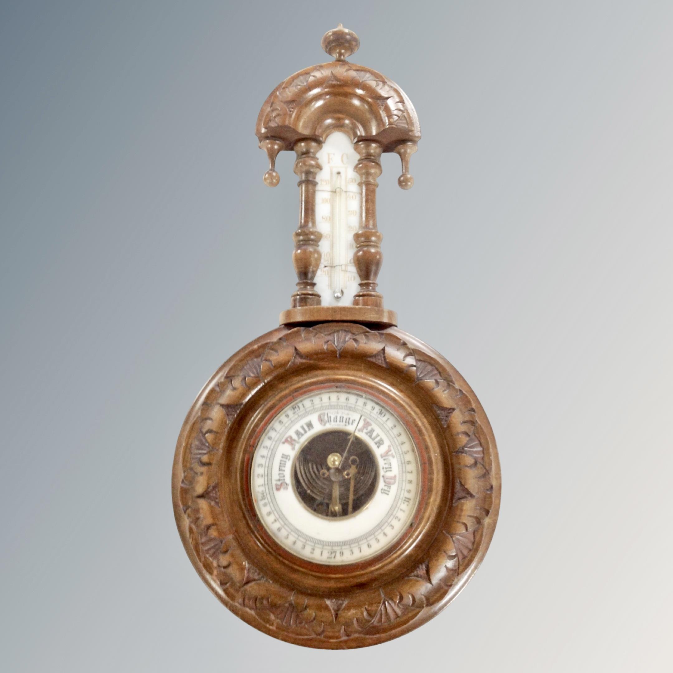 A carved Edwardian barometer