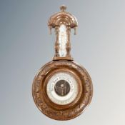 A carved Edwardian barometer