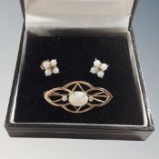 A 14 carat gold and opal bar brooch with matching earnings.
