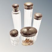 Five glass silver-topped dressing table jars.