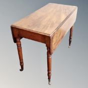 A Victorian mahogany flap sided table