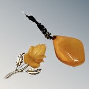 An amber pendant and an .835 silver mounted brooch stamped SBM.