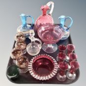 A tray containing antique and later glassware to include cranberry glass jug, comport,