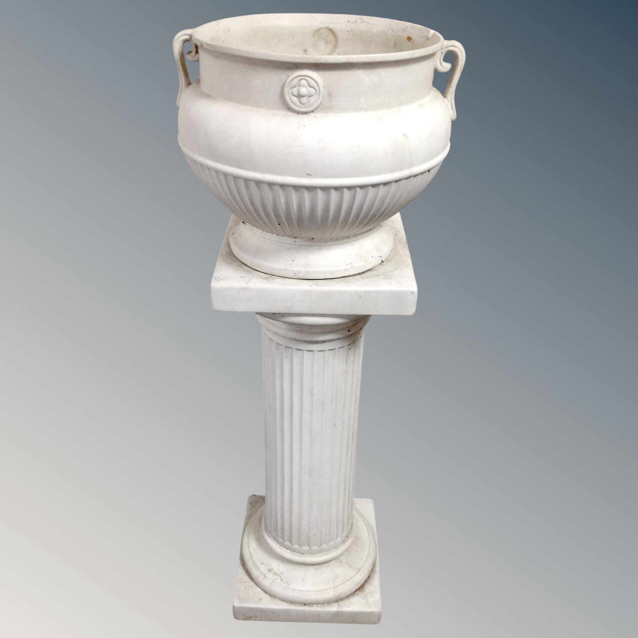 A ceramic classical-style twin-handled jardiniere on column stand