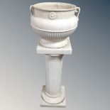 A ceramic classical-style twin-handled jardiniere on column stand