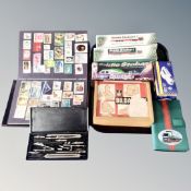 A tray of stamp album containing world stamps, vintage Jayco products building blocks,