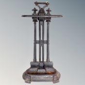 A 19th century cast iron stick stand with lift out tray