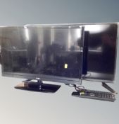 Two LCD TV's by Logik and Polaroid, both with remotes.