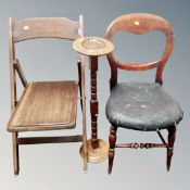 A folding campaign style chair together with a smoker's stand and a antique chair