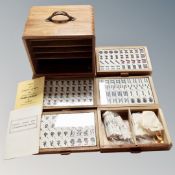 A Mahjong set, in a wooden five-drawer chest.