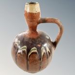 An antique glazed pottery wine jug, height 28cm.