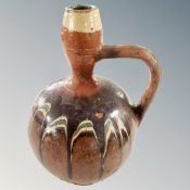 An antique glazed pottery wine jug, height 28cm.