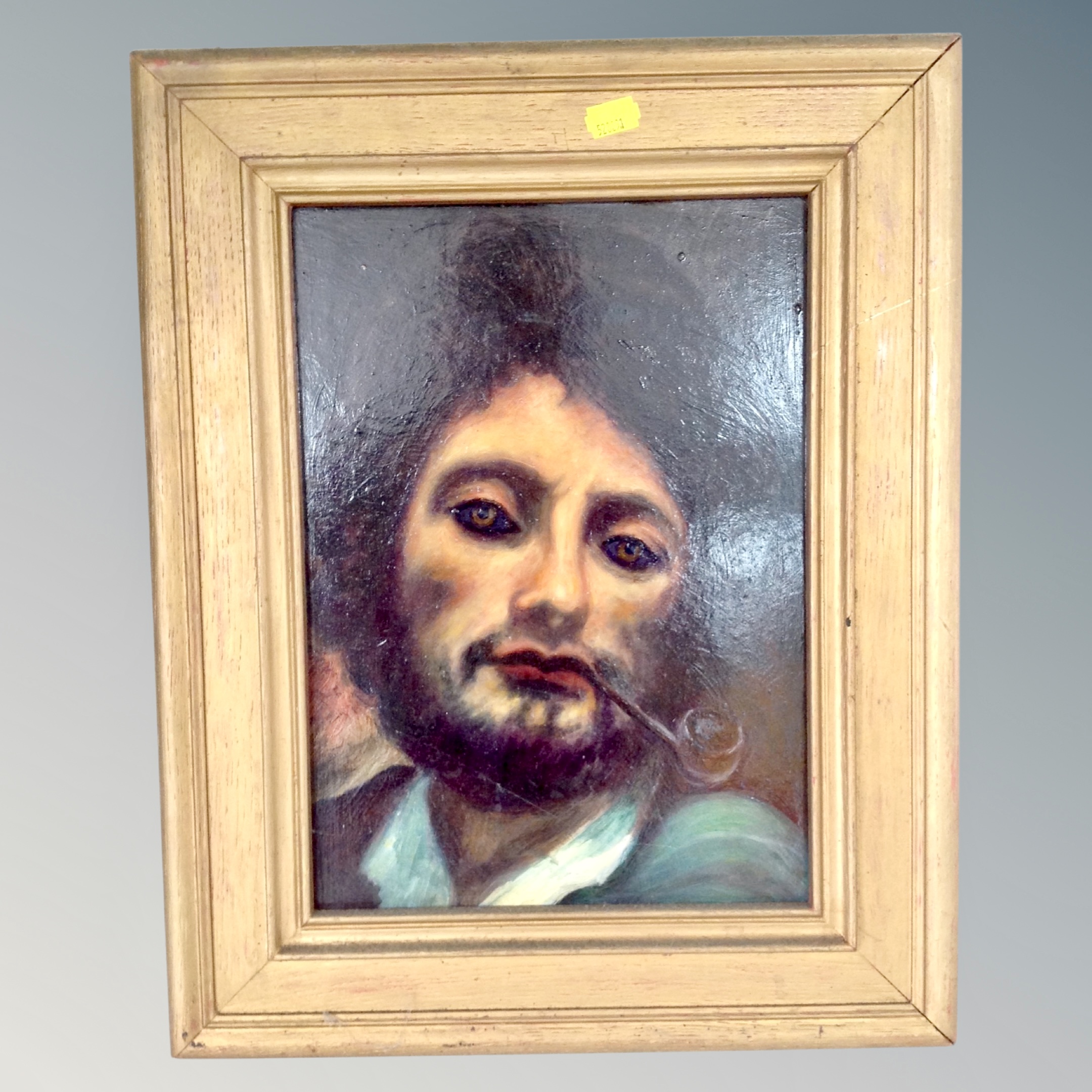 A 20th century oil on board : portrait of a man smoking a pipe, 33cm by 24cm,