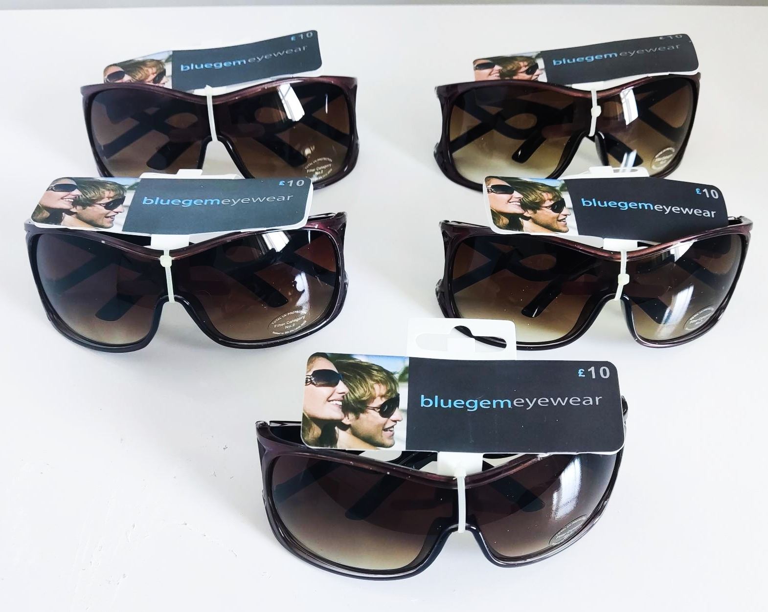 A collection of new Blue Gem Eyewear sunglasses with price tags.