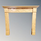 A Victorian style pine fire surround