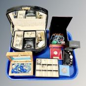 A tray of several jewellery boxes containing costume jewellery, crowns,