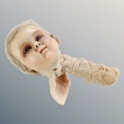 A Victorian wax doll's head.
