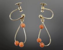 A pair of 9ct gold coral earrings with screw backs. CONDITION REPORT: 1.