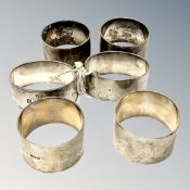 Three pairs of heavy gauge silver serviette rings, 314g.