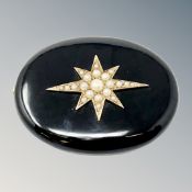 A Victorian black agate memorial brooch inset seed pearls with gold mounted reverse.