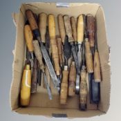 A box of vintage woodworking chisels