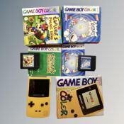 A Nintendo Gameboy colour (yellow) with box and original booklets together with two Nintendo
