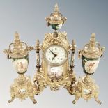 An ornate reproduction three piece clock garniture set